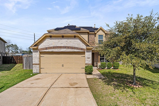 15307 Meandering Post Trl, Houston, TX 77044 - traditional home featuring roof mounted solar panels, concrete driveway, a garage, brick siding, and stone siding