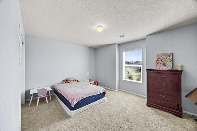 15307 Meandering Post Trl, Houston, TX 77044 - carpeted bedroom featuring a textured ceiling and baseboards