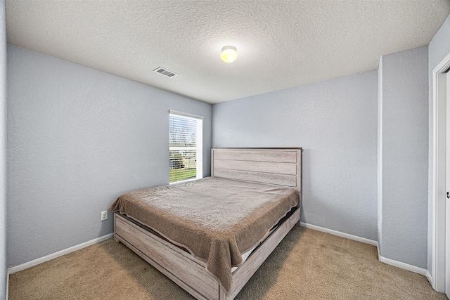 15307 Meandering Post Trl, Houston, TX 77044 - bedroom with carpet, a textured ceiling, and baseboards