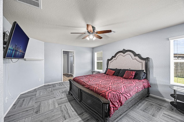 15307 Meandering Post Trl, Houston, TX 77044 - bedroom featuring baseboards, a textured ceiling, and a ceiling fan