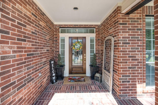 property entrance with brick siding