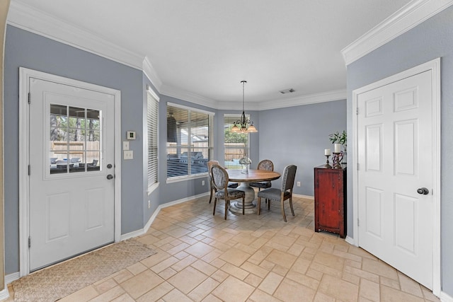 dining area with a wealth of natural light, baseboards, crown molding, and stone tile floors