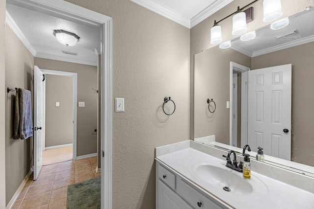 bathroom featuring a textured ceiling, visible vents, crown molding, and tile patterned floors