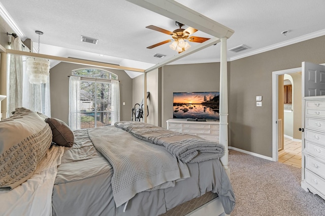 bedroom featuring visible vents, arched walkways, crown molding, and light colored carpet