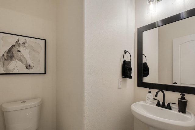 bathroom featuring a sink and toilet