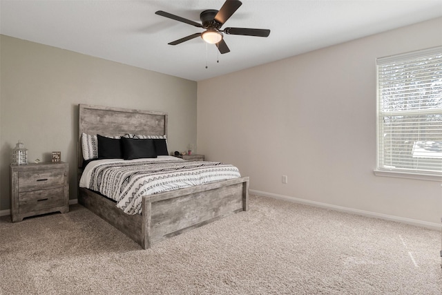 bedroom featuring carpet floors, ceiling fan, and baseboards