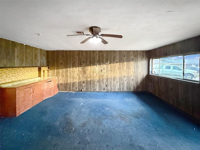 8611 Sunmoore Ct, Houston, TX 77088 - spare room featuring visible vents and wood walls