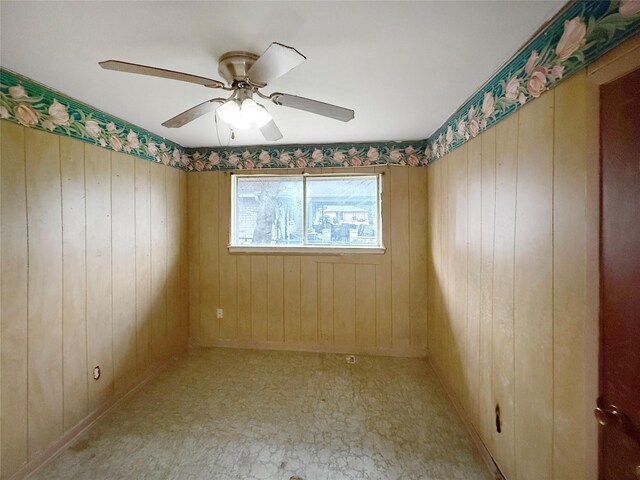 8611 Sunmoore Ct, Houston, TX 77088 - spare room featuring a ceiling fan and wooden walls