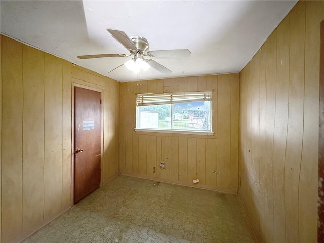 8611 Sunmoore Ct, Houston, TX 77088 - unfurnished room with wood walls and ceiling fan