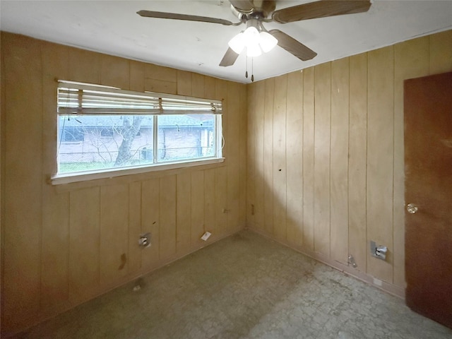 8611 Sunmoore Ct, Houston, TX 77088 - spare room featuring ceiling fan and wood walls