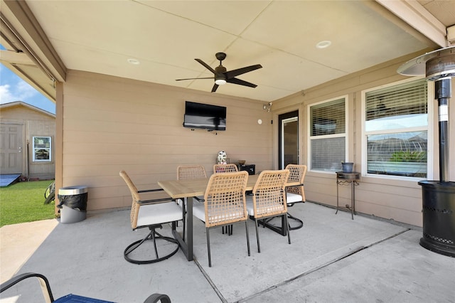 view of patio / terrace with outdoor dining space and a ceiling fan