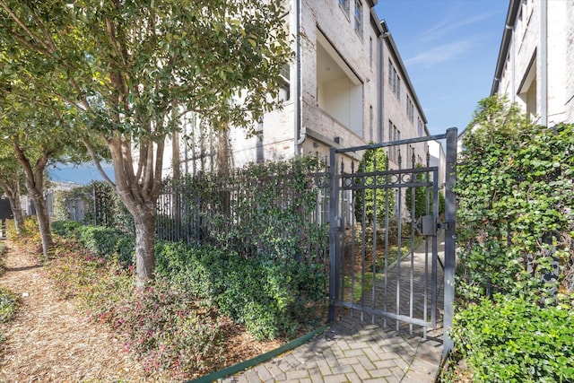 view of gate featuring fence