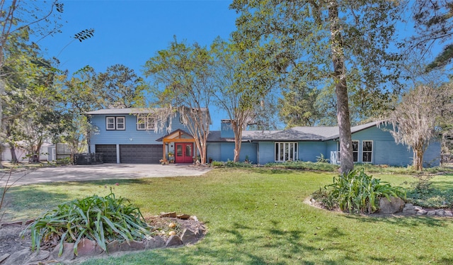 view of front of property with concrete driveway, an attached garage, and a front lawn