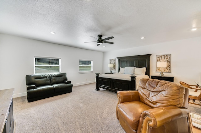 206 County Road 142, Burnet, TX 78611 - bedroom featuring light carpet, a textured ceiling, baseboards, and recessed lighting