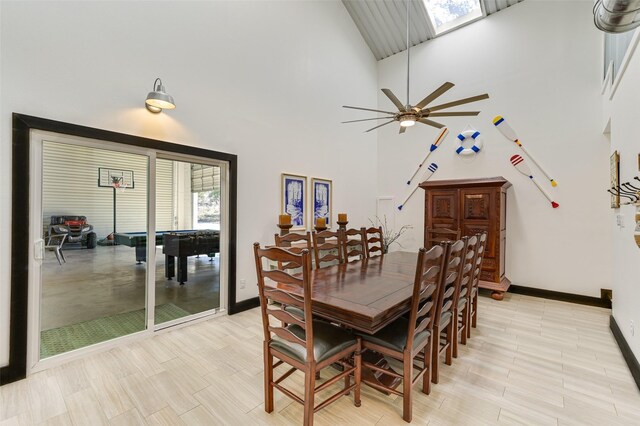 206 County Road 142, Burnet, TX 78611 - dining room with a towering ceiling, a skylight, ceiling fan, and baseboards