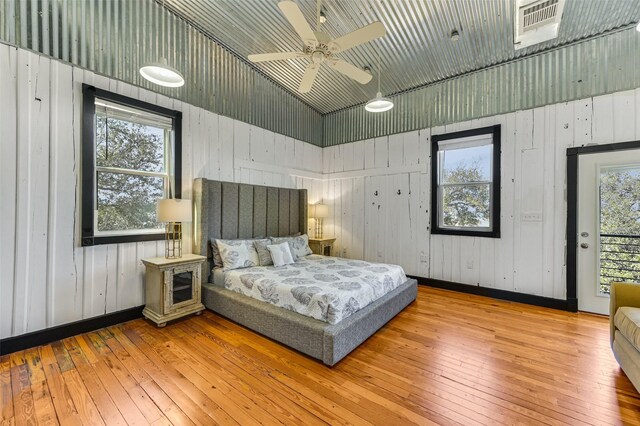 206 County Road 142, Burnet, TX 78611 - bedroom featuring access to outside, wood-type flooring, and baseboards
