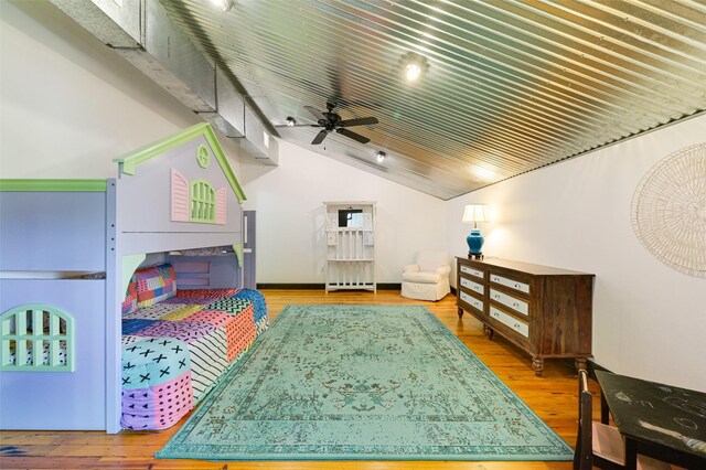206 County Road 142, Burnet, TX 78611 - bedroom with lofted ceiling and wood finished floors