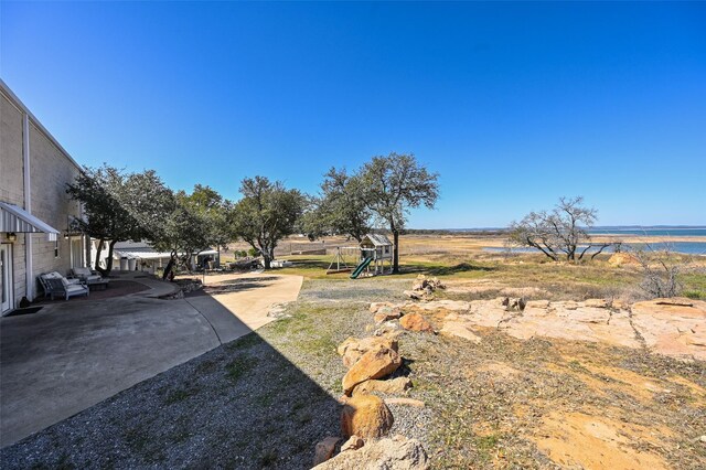 206 County Road 142, Burnet, TX 78611 - view of yard featuring playground community and a patio