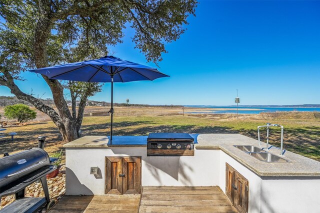 206 County Road 142, Burnet, TX 78611 - view of patio with a water view, a sink, grilling area, and an outdoor kitchen