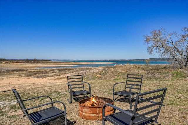 206 County Road 142, Burnet, TX 78611 - exterior space with an outdoor fire pit and a water view