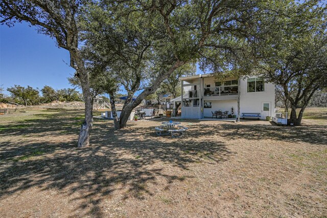 206 County Road 142, Burnet, TX 78611 - rear view of house with an outdoor fire pit