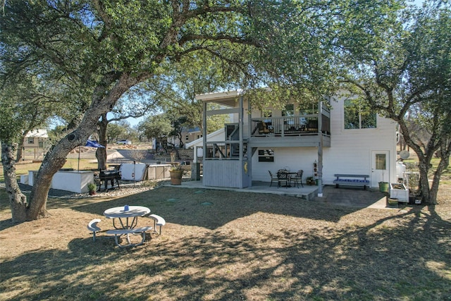 206 County Road 142, Burnet, TX 78611 - back of house featuring a balcony and a patio