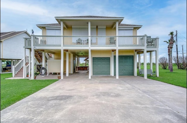 coastal inspired home featuring stairs, a carport, a front lawn, and a shingled roof