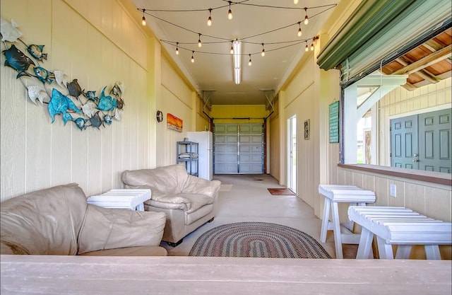 garage featuring wood walls