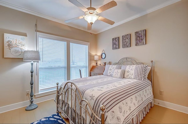 bedroom with ornamental molding, wood finished floors, a ceiling fan, and baseboards