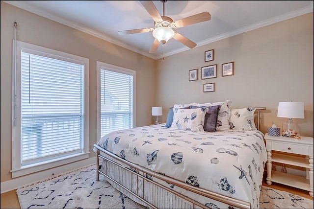 bedroom featuring ceiling fan and ornamental molding