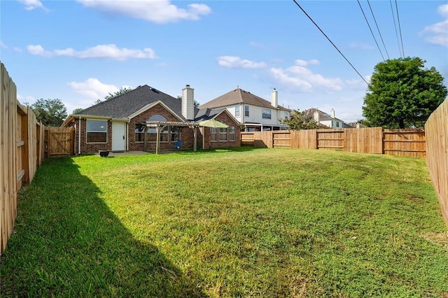 view of yard featuring a fenced backyard