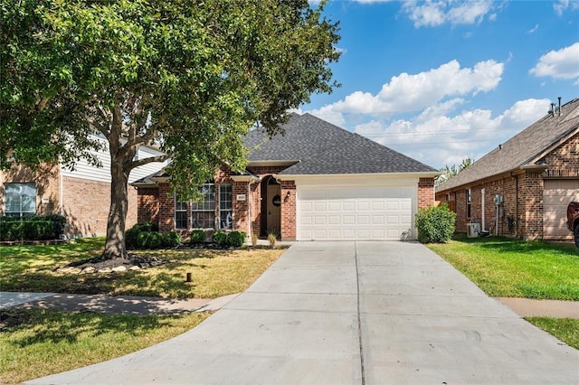 ranch-style home featuring a garage, a front yard, concrete driveway, and brick siding