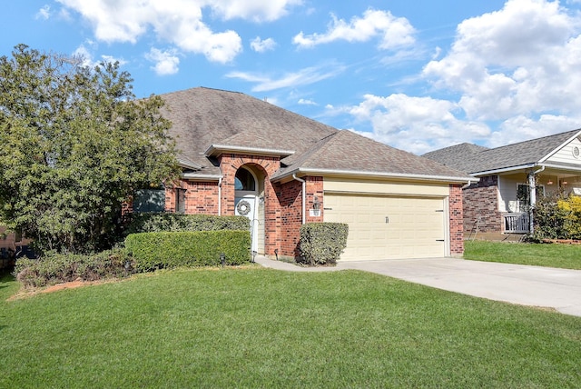 view of front of house with driveway, a garage, roof with shingles, a front lawn, and brick siding