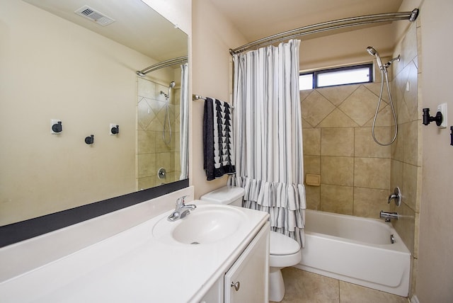 bathroom with visible vents, toilet, shower / bath combo, vanity, and tile patterned floors