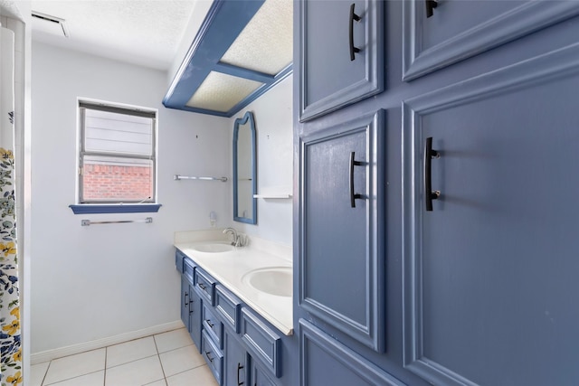 full bath featuring double vanity, tile patterned flooring, a sink, and visible vents