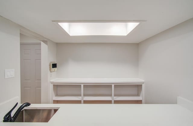 interior space featuring light countertops and a sink