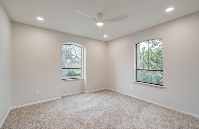 spare room featuring carpet, ceiling fan, baseboards, and recessed lighting