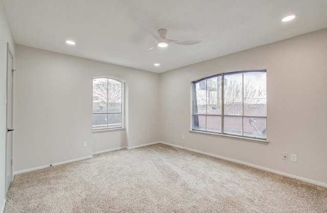 unfurnished room with carpet floors, ceiling fan, baseboards, and recessed lighting