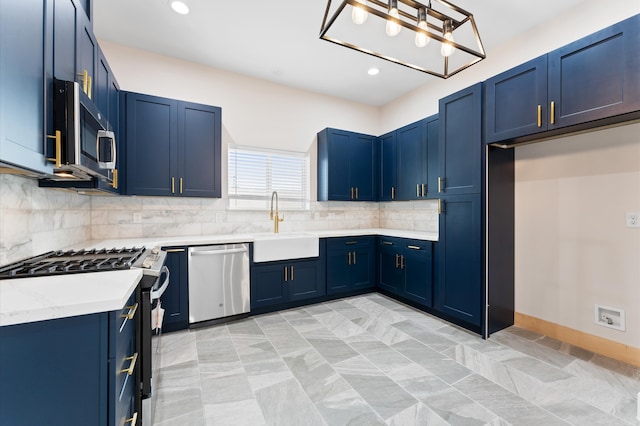 kitchen with blue cabinets, a sink, tasteful backsplash, recessed lighting, and appliances with stainless steel finishes