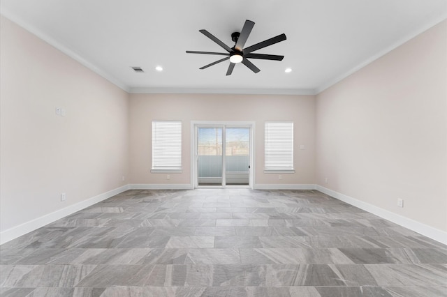 empty room with crown molding, visible vents, and baseboards