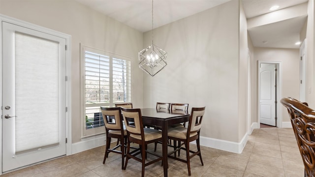 44 Tall Trl, Missouri City, TX 77459 - dining space featuring tile patterned floors, baseboards, and a notable chandelier
