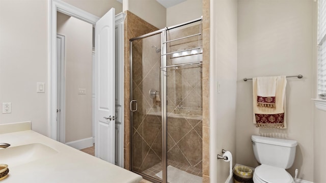 44 Tall Trl, Missouri City, TX 77459 - full bath with toilet, baseboards, a sink, and a stall shower