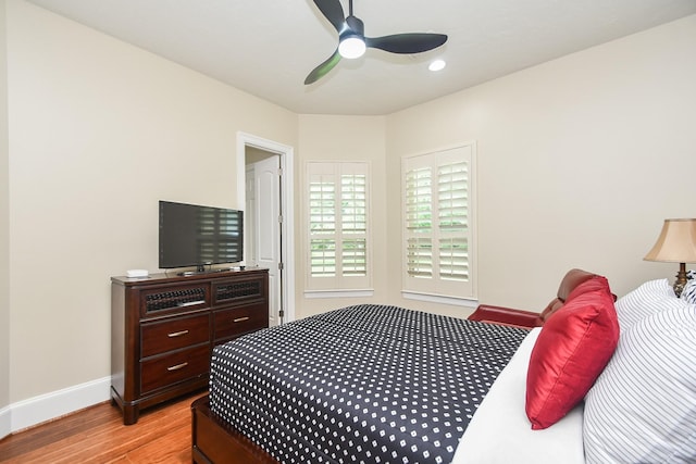 44 Tall Trl, Missouri City, TX 77459 - bedroom with baseboards, a ceiling fan, and light wood-style floors