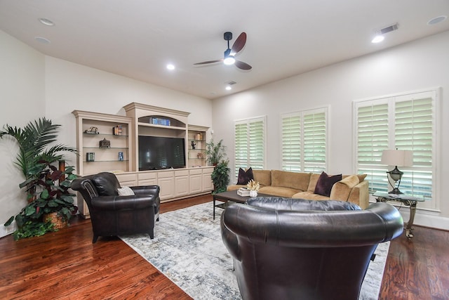 44 Tall Trl, Missouri City, TX 77459 - living room with dark wood finished floors, a ceiling fan, and visible vents