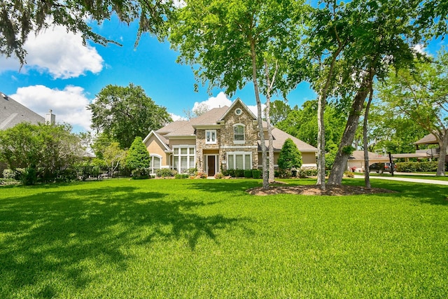 44 Tall Trl, Missouri City, TX 77459 - english style home featuring stone siding and a front lawn
