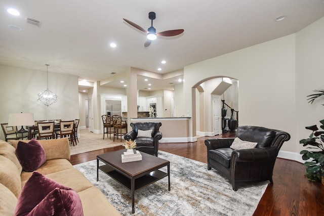 44 Tall Trl, Missouri City, TX 77459 - living area featuring recessed lighting, wood finished floors, visible vents, a ceiling fan, and arched walkways