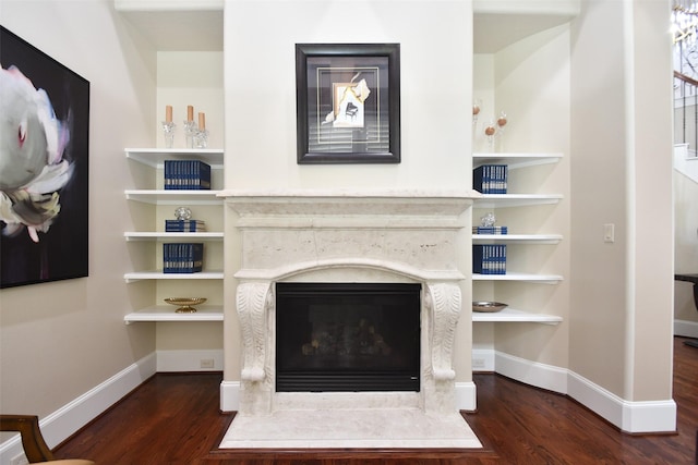 44 Tall Trl, Missouri City, TX 77459 - details with a premium fireplace, baseboards, and wood finished floors