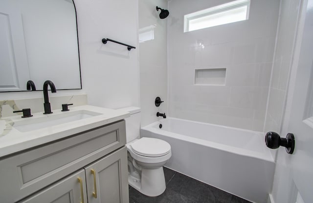 bathroom with shower / washtub combination, vanity, and toilet