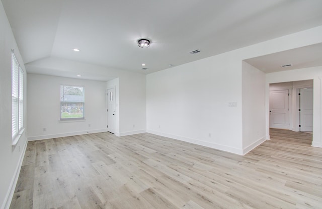 empty room featuring baseboards, recessed lighting, and light wood-style floors