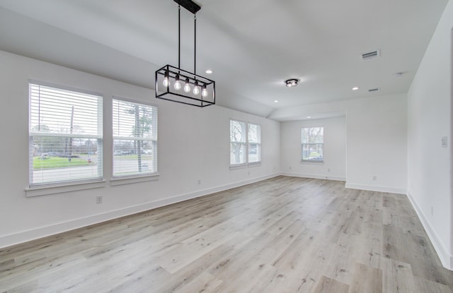 unfurnished room with light wood-type flooring, visible vents, baseboards, and recessed lighting